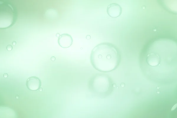 Soap bubbles on green background, abstract background. — Stock Photo, Image
