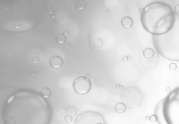 Burbujas de jabón sobre fondo gris, fondo abstracto . — Foto de Stock