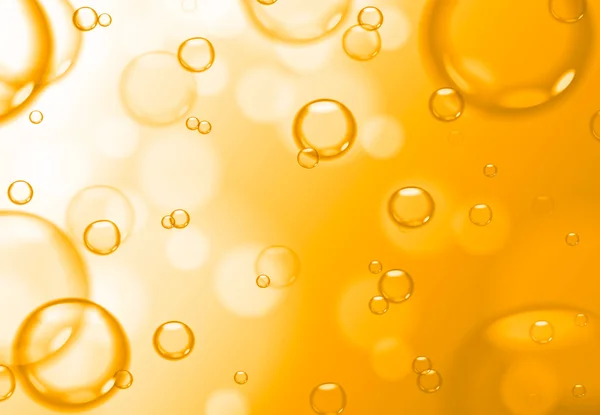 Soap bubbles on gold background, yellow abstract background. Stock Photo
