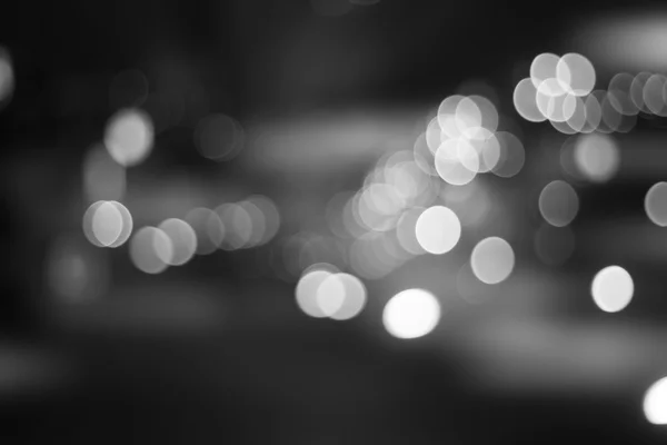 Ciudad desenfocada noche filtrado bokeh abstracto fondo. — Foto de Stock