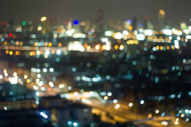 Yokedilmiş şehir gecesi filtrelenmiş Bokeh soyut arkaplanı.