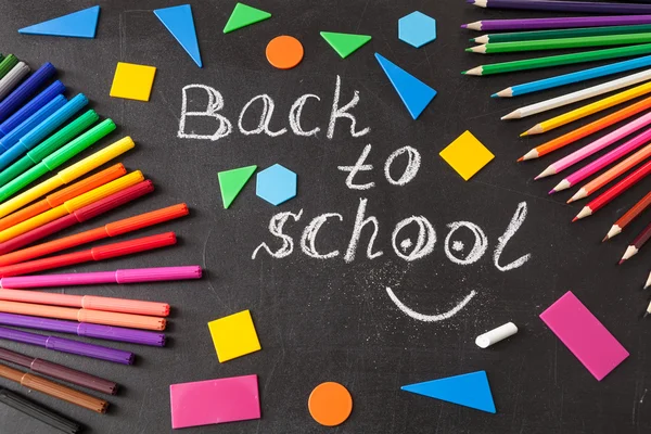 Back to school background with colorful felt tip pens, pencils,  title 