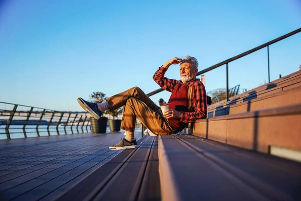 Side View Bearded Hipster Senior Man Sitting Stairs Outdoors Drinking — Stock Photo, Image