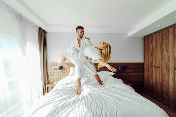 Cheerful Middle Aged Couple Bathrobes Celebrating Anniversary Hotel Man Holding — Stock Photo, Image