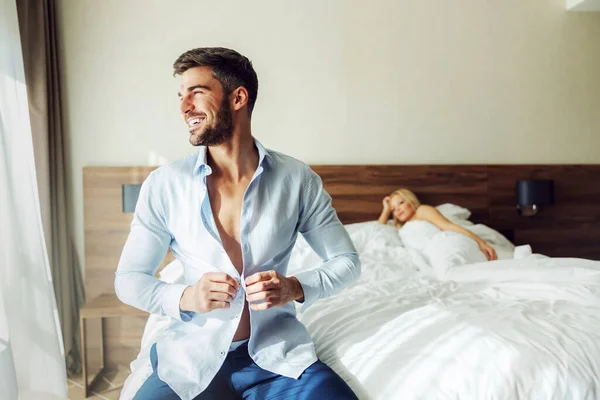 Middle Aged Man Sitting Bed Hotel Buttoning His Shirt His — Stock Photo, Image