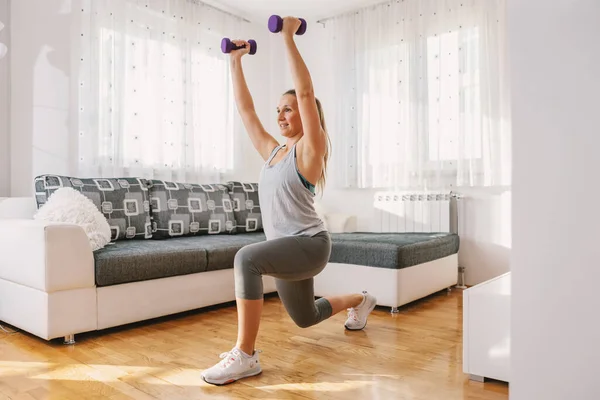 Sportswoman Excellent Shape Doing Lunges While Holding Dumbbells Home — Stock Photo, Image