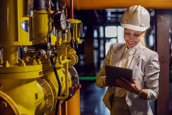 Blond Dedicated Successful Businesswoman Formal Wear Checking Machinery Holding Tablet — Stock Photo, Image