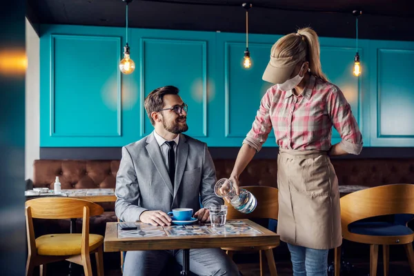 Restaurant Service Hospitality Professional Waitress Pours Water Jug Male Guest — Stock Photo, Image