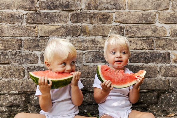 Babies Watermelon Twins White Bodysuits Children Beautiful Blue Eyes Blonde Stock Picture
