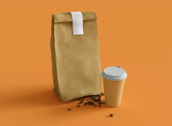 Sacchetto di carta e tazza di caffè — Foto Stock