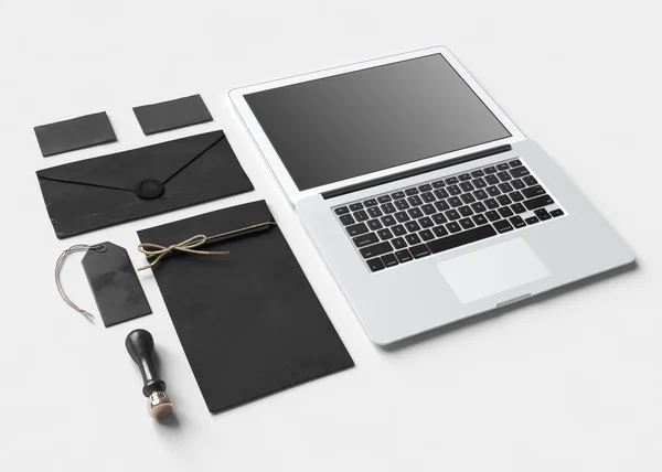 Set of  paper branding elements with laptop — Stock Photo, Image