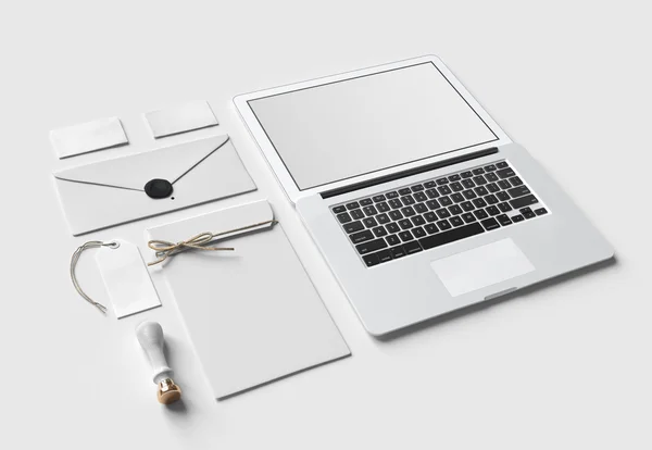 Set of  paper branding elements with laptop — Stock Photo, Image