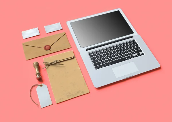 Set of  paper branding elements with laptop — Stock Photo, Image