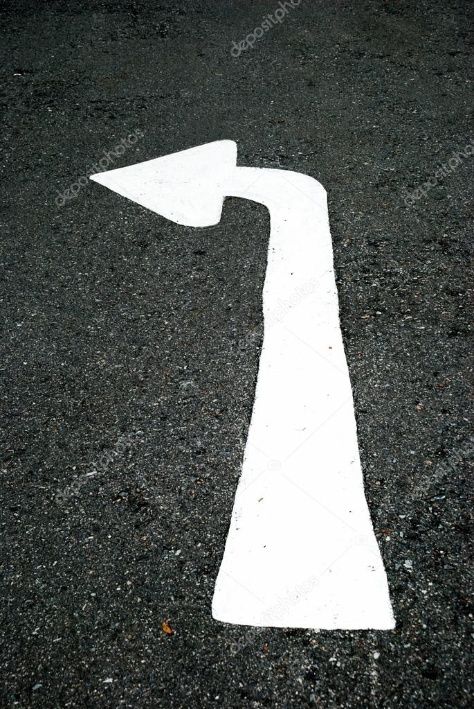 Turn-left arrow on street