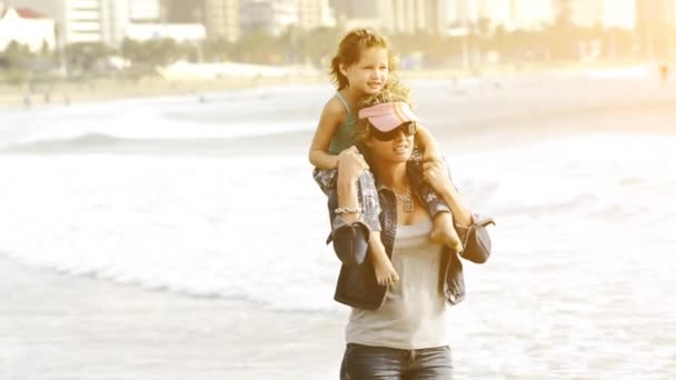 Girl sitting on mother's shoulders — Stock Video