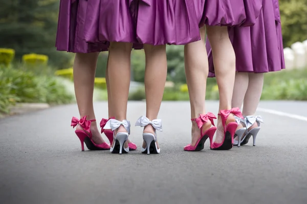 Brides maids feet walking in street
