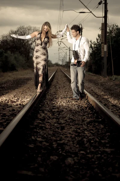 Couple on train tracks — Stock Photo, Image