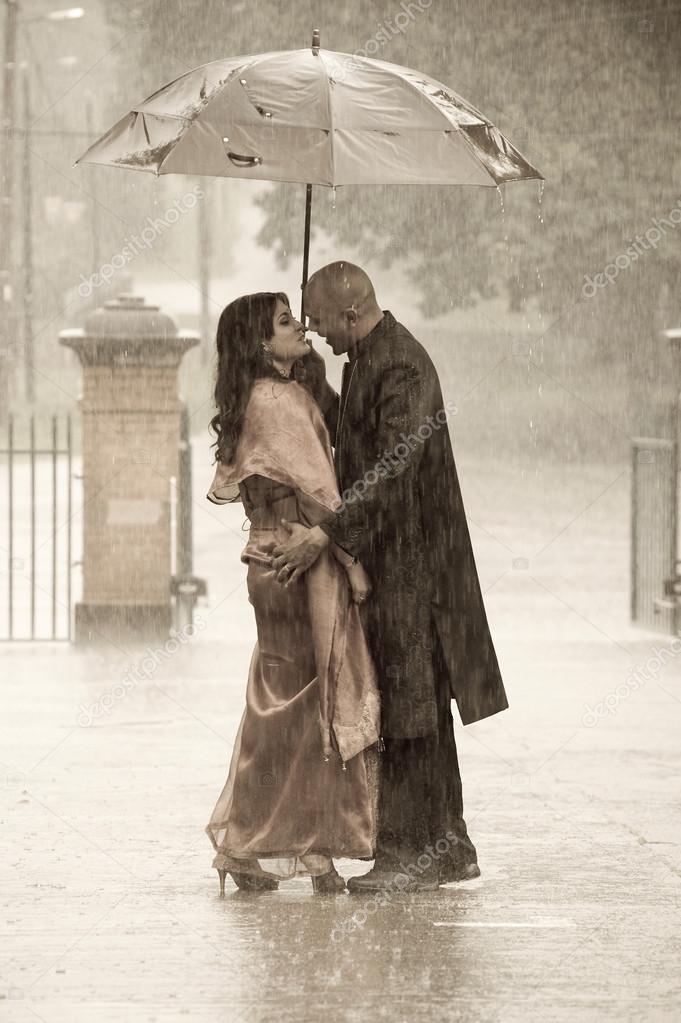 Indian couple under rain