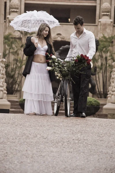 Groom and bride walking in street — Stock Photo, Image