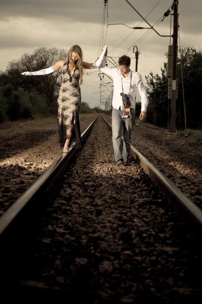 Couple on train tracks — Stock Photo, Image