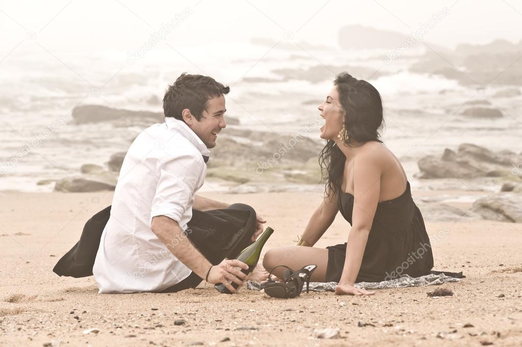 Young attractive couple beach romantic happy laughing