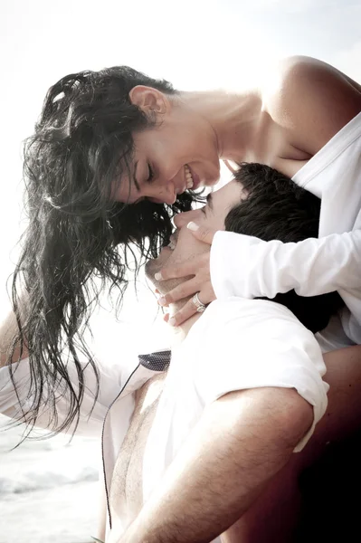 Young in love couple flirting at the beach — Stock Photo, Image