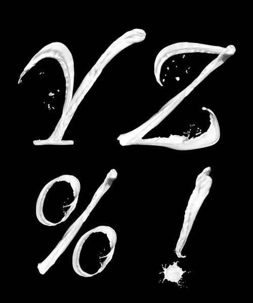 Buchstaben von Spritzern Milch Y Z% ! Stockbild