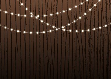 Pankart ya da sunum için şenlikli arkaplan ya da parlak sicim ışıkları ya da ahşap dokuda ya da çitte çelenk bulunan tebrik kartı.