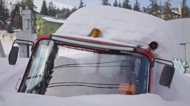 An old snowcat almost fully covered in snow — Stock Video