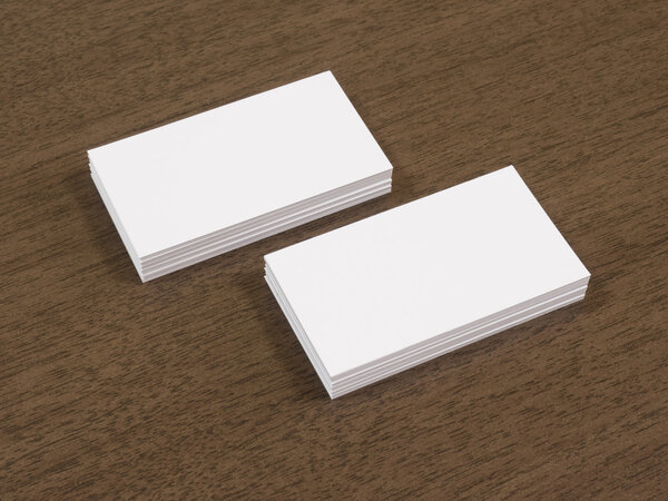 Business cards blank mockup on brown wooden table.