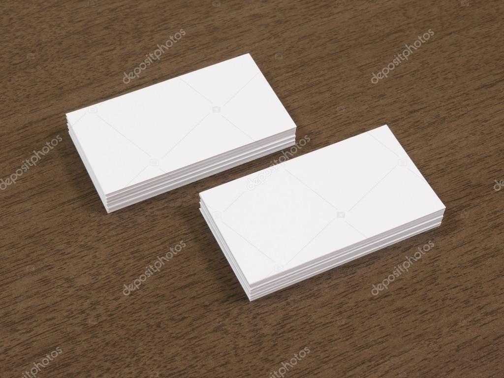 Business cards blank mockup on brown wooden table.