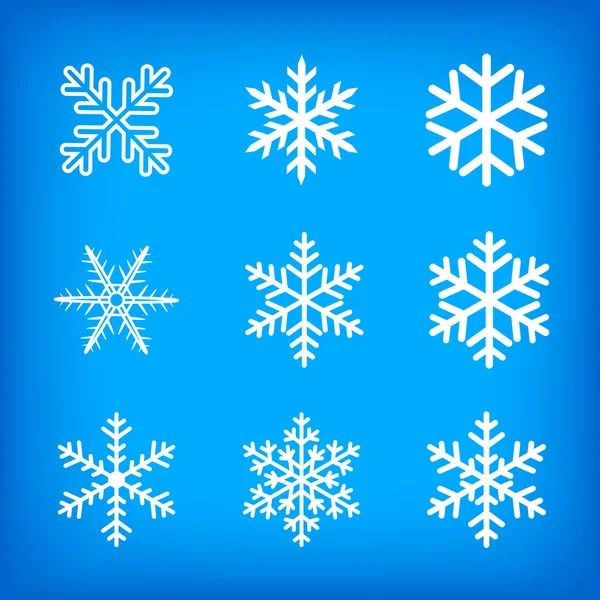Kék alapon fehér hópelyhek — Stock Vector