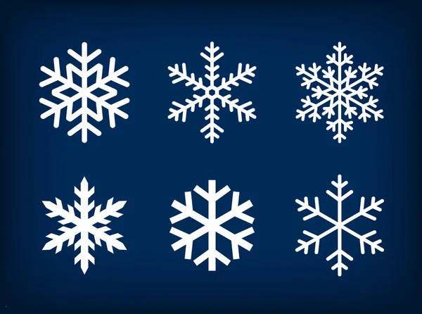 Flocos de neve brancos no fundo azul escuro —  Vetores de Stock