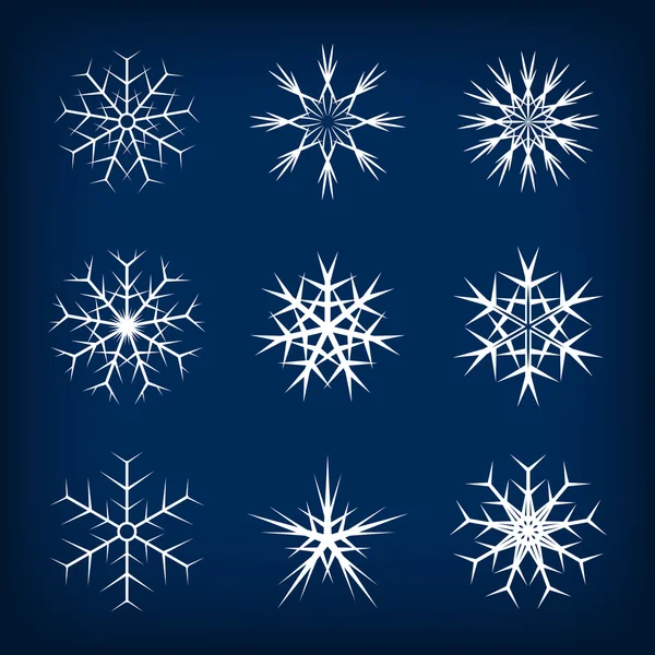 Ensemble de flocons de neige vectoriels sur fond bleu foncé . — Image vectorielle