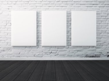 Üç poster duvarda asılı