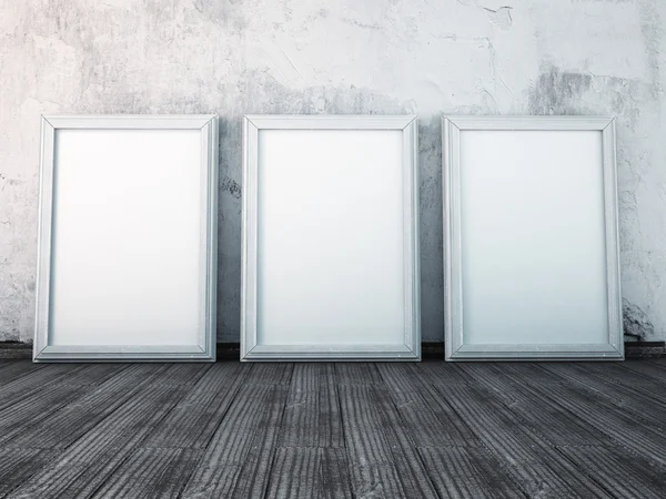 Three posters stand on the floor — Stock Photo, Image