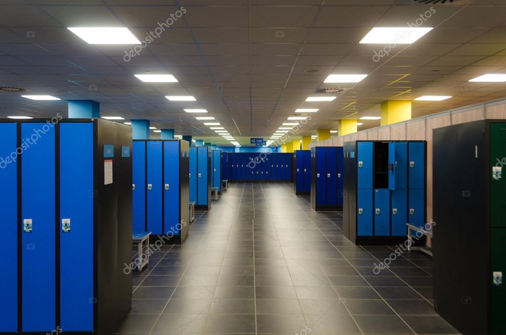 An Empty Locker Room With Rows Of Cabinets Stock Photo