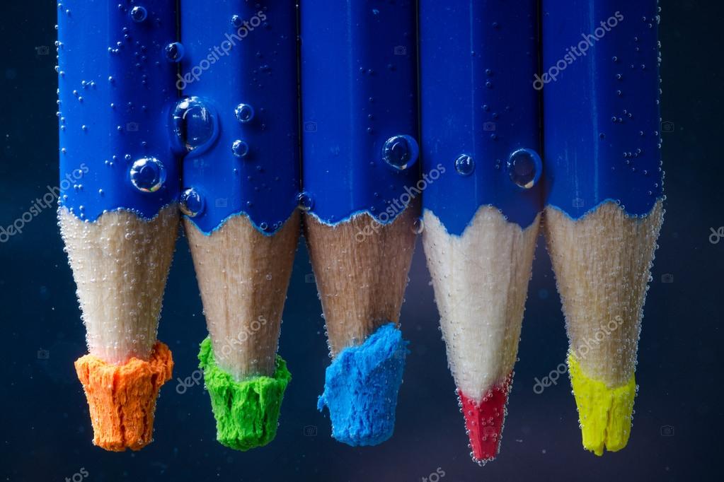 Colored pencils with bubbles in the water — Stock Photo © Antonij81