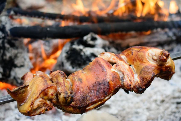 Pork roast with crackling roasting on charcoal grill — Stock Photo, Image