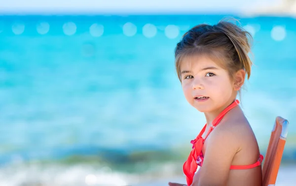 Cute little girl at tropical beach Stock Picture