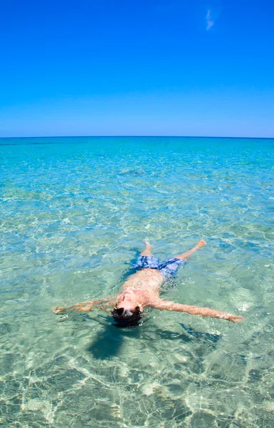 Little boy in sea water — Stock Photo, Image