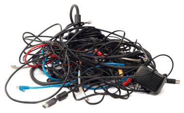 Heap of computer cables isolated on white clipart