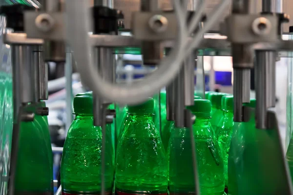 green bottles on conveyor