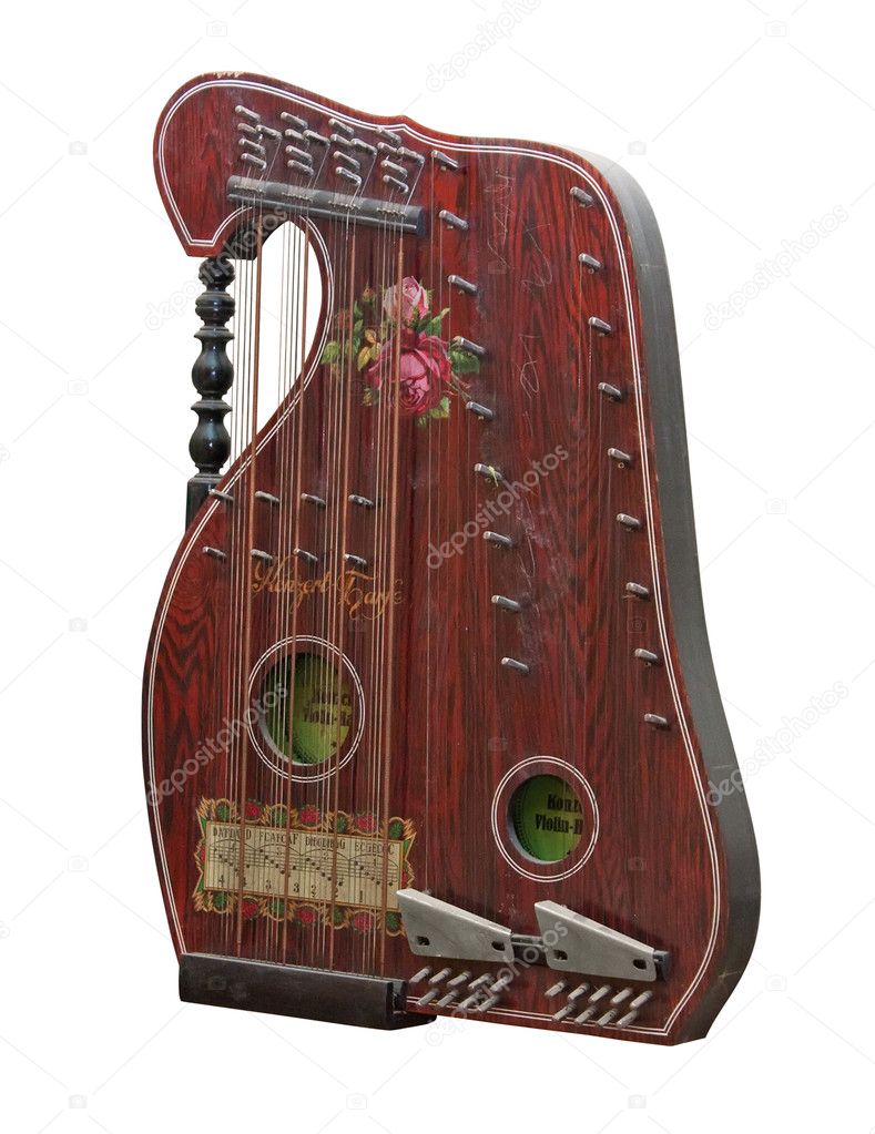 Vintage alpine zither instrument isolated over white. Clipping path included.