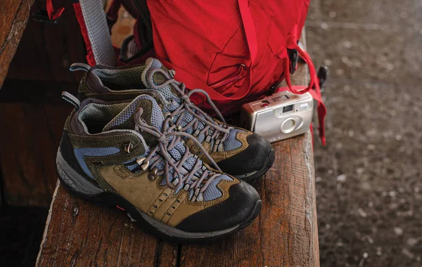 Backpacks, shoes, cameras at the train station with travel train travel ideas.