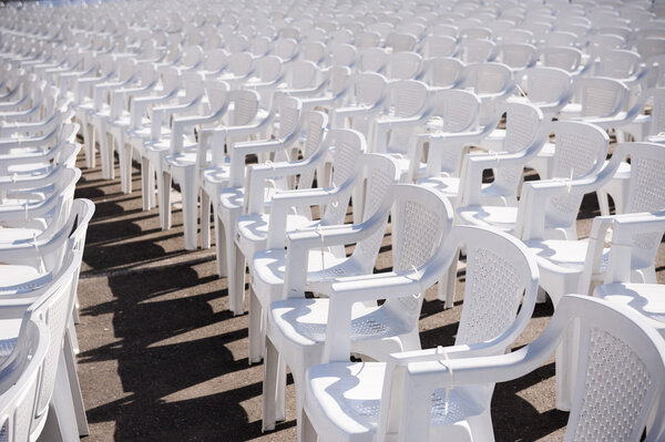 rows of empty chairs at concert