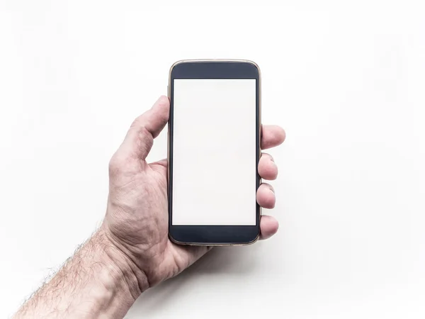 La mano del hombre sosteniendo y utilizando el teléfono inteligente móvil sobre fondo blanco —  Fotos de Stock