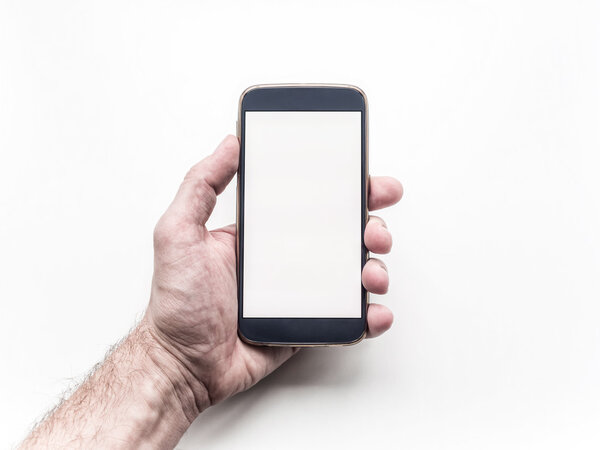 Man's hand holding and using mobile smartphone on white background