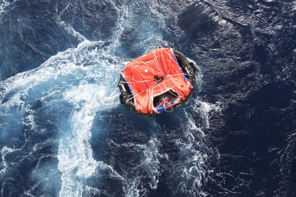 Life raft in rough seas — Stock Photo, Image