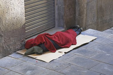 Sleeping rough on the streets clipart